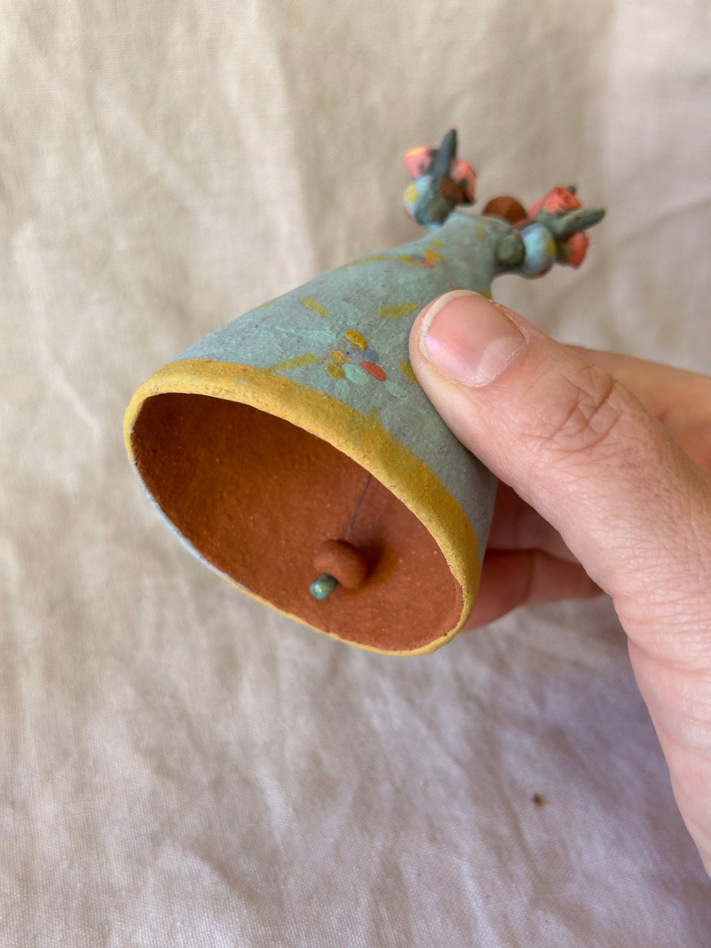 Dancer Bell holding two flower bouquets - light blue dress flower designs