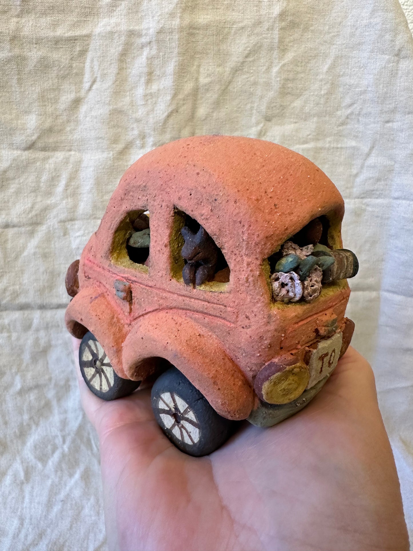 Family Trip with a Pink Beetle Car - mechanical wheels - miniature sculpture