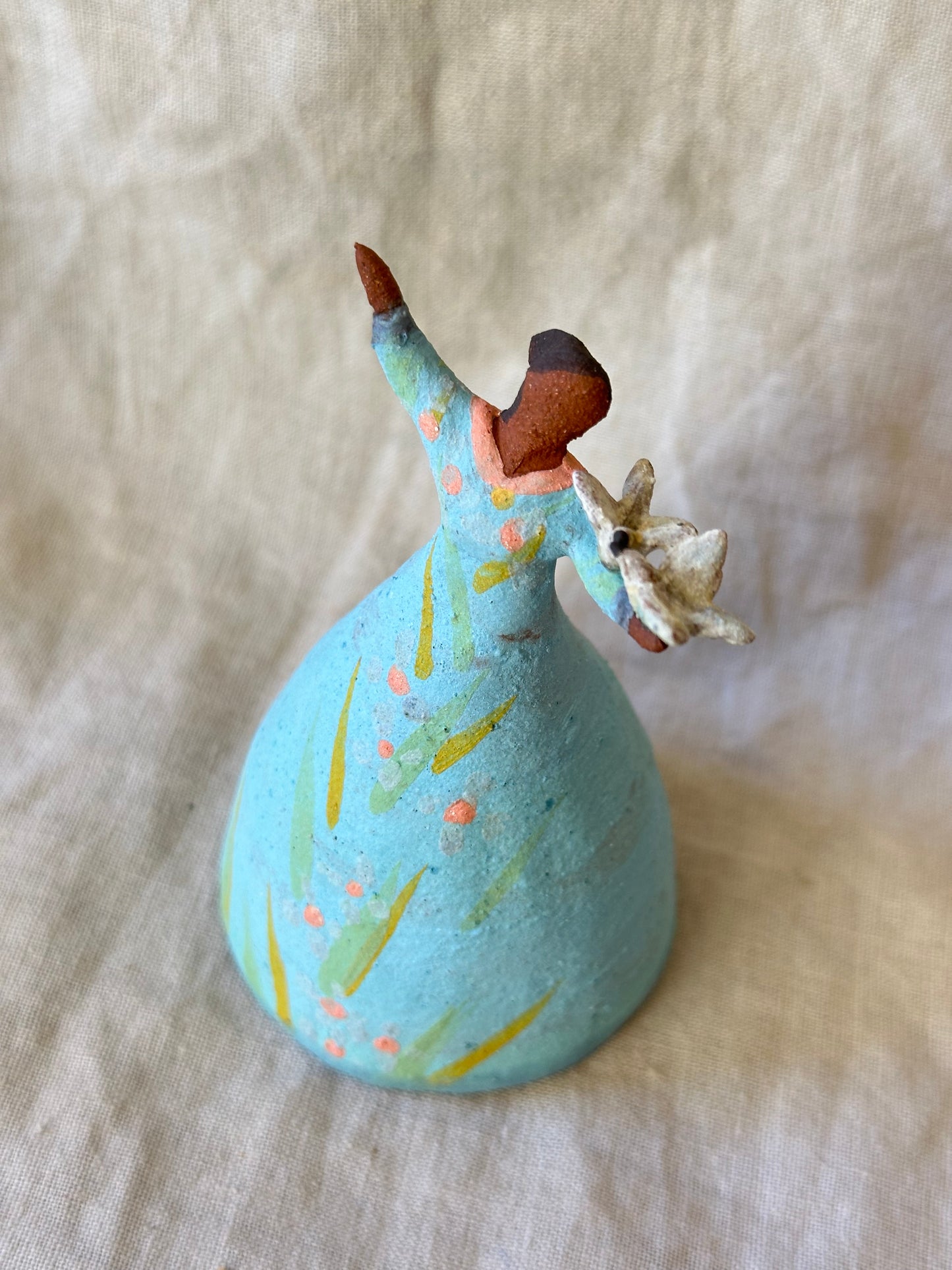 Dancer Bell holding birds - blue dress pink dots accents