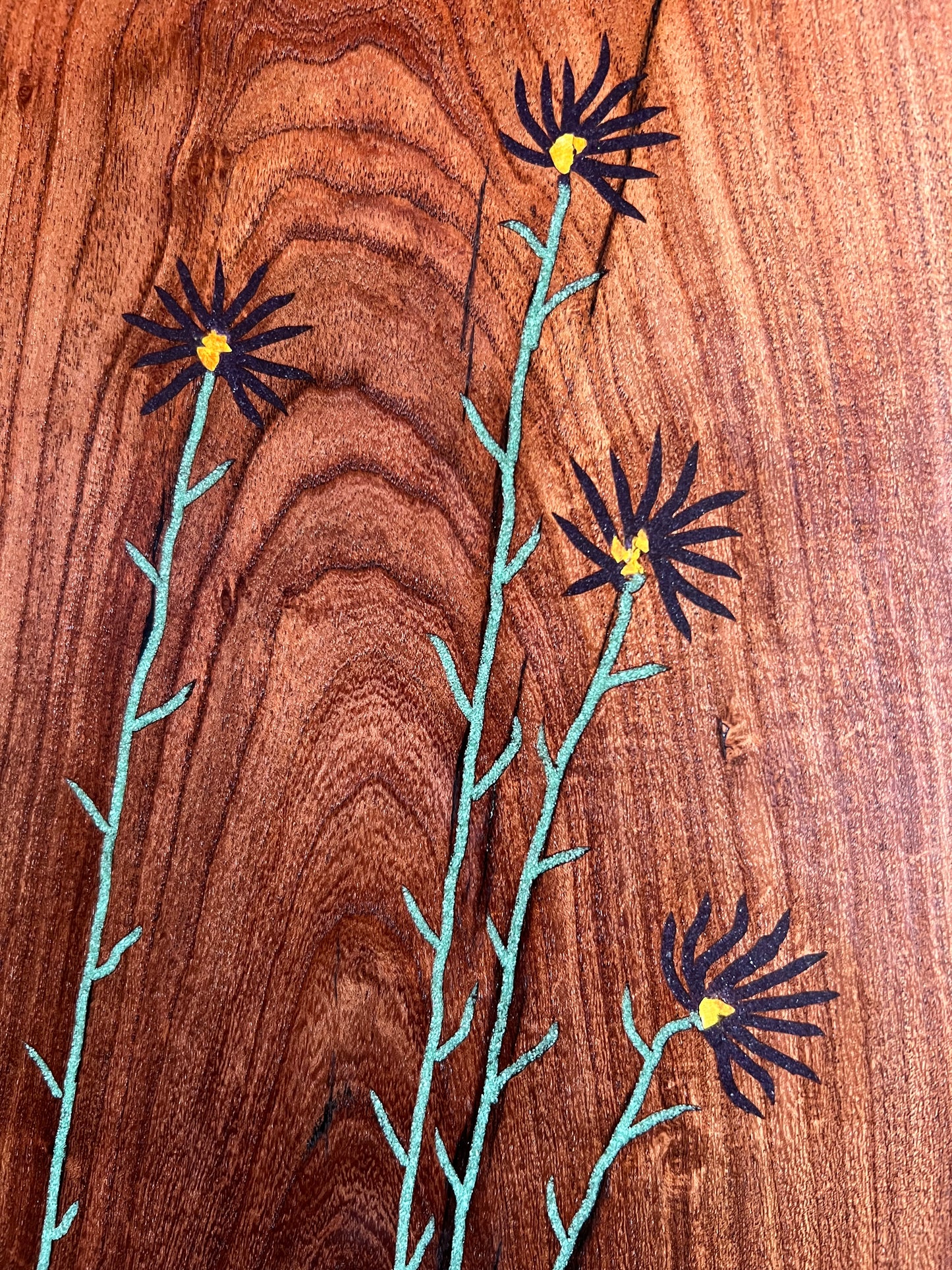Purple Asters. Turquoise, Orpiment, and Lapis inlaid in velvet mesquite.