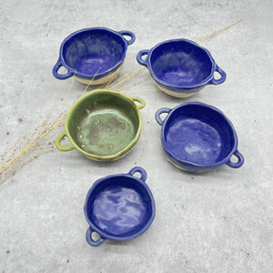Assorted bowls with handles