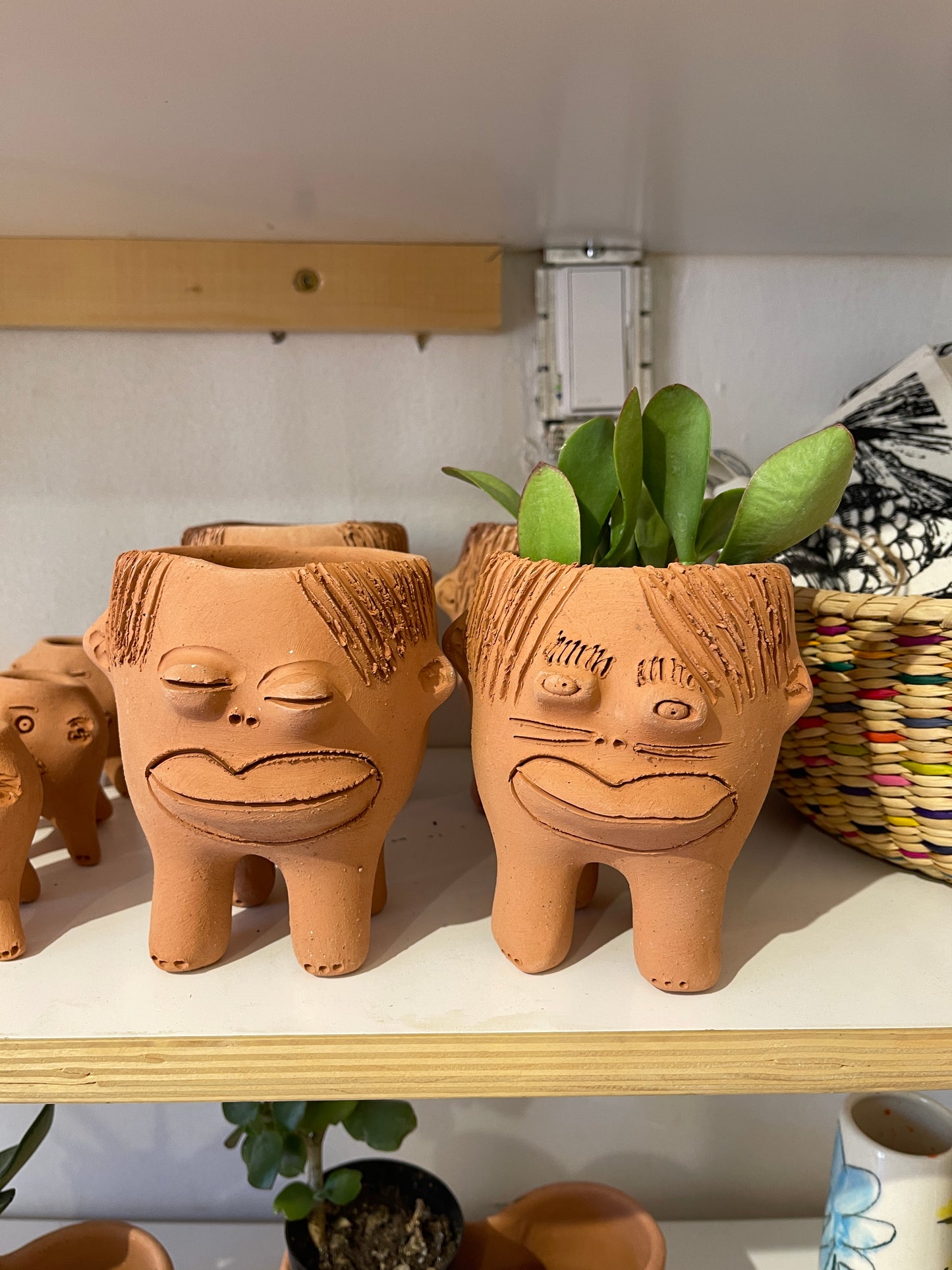 Bigotes ~ Terracota face planter with legs