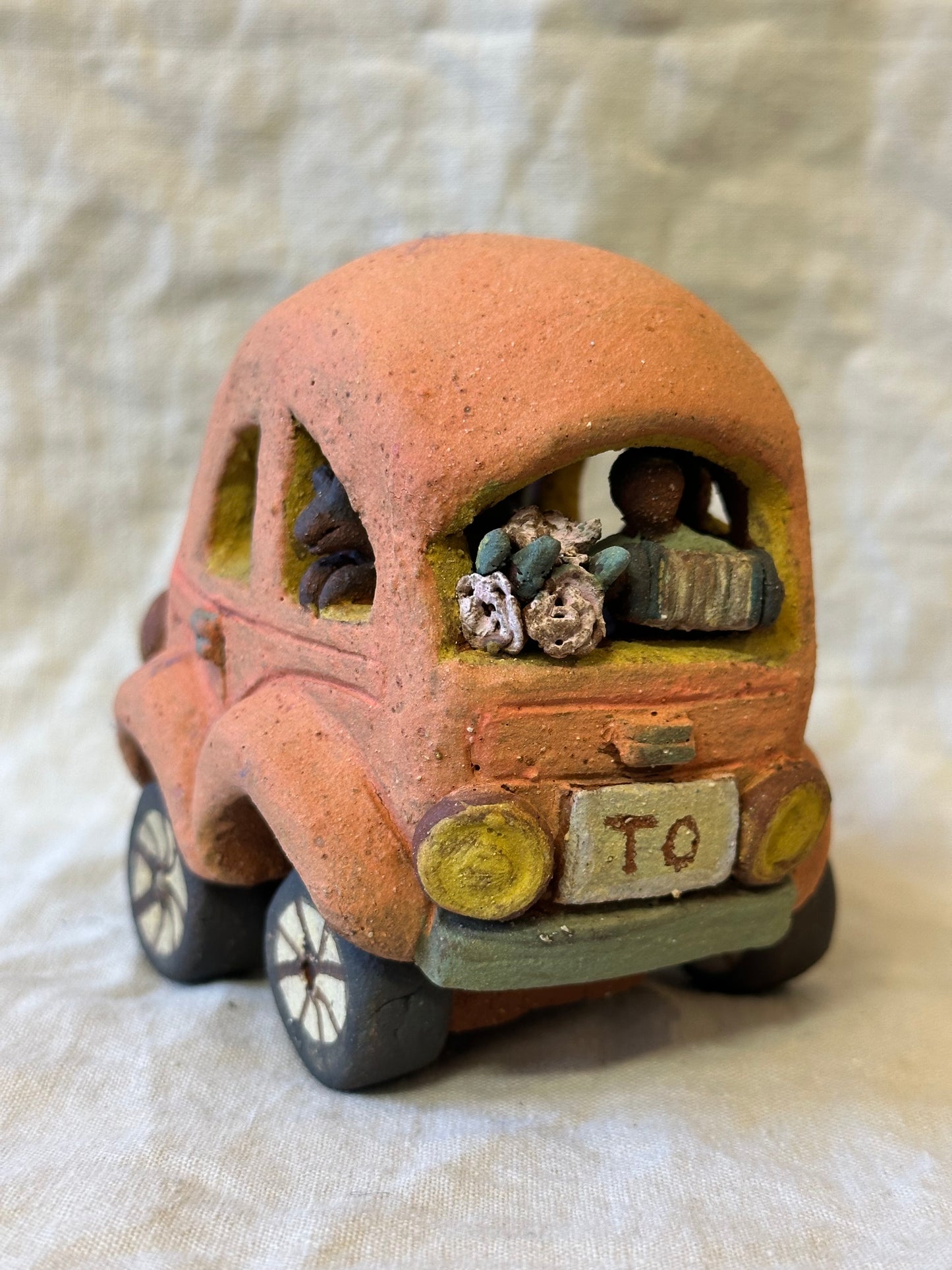Family Trip with a Pink Beetle Car - mechanical wheels - miniature sculpture