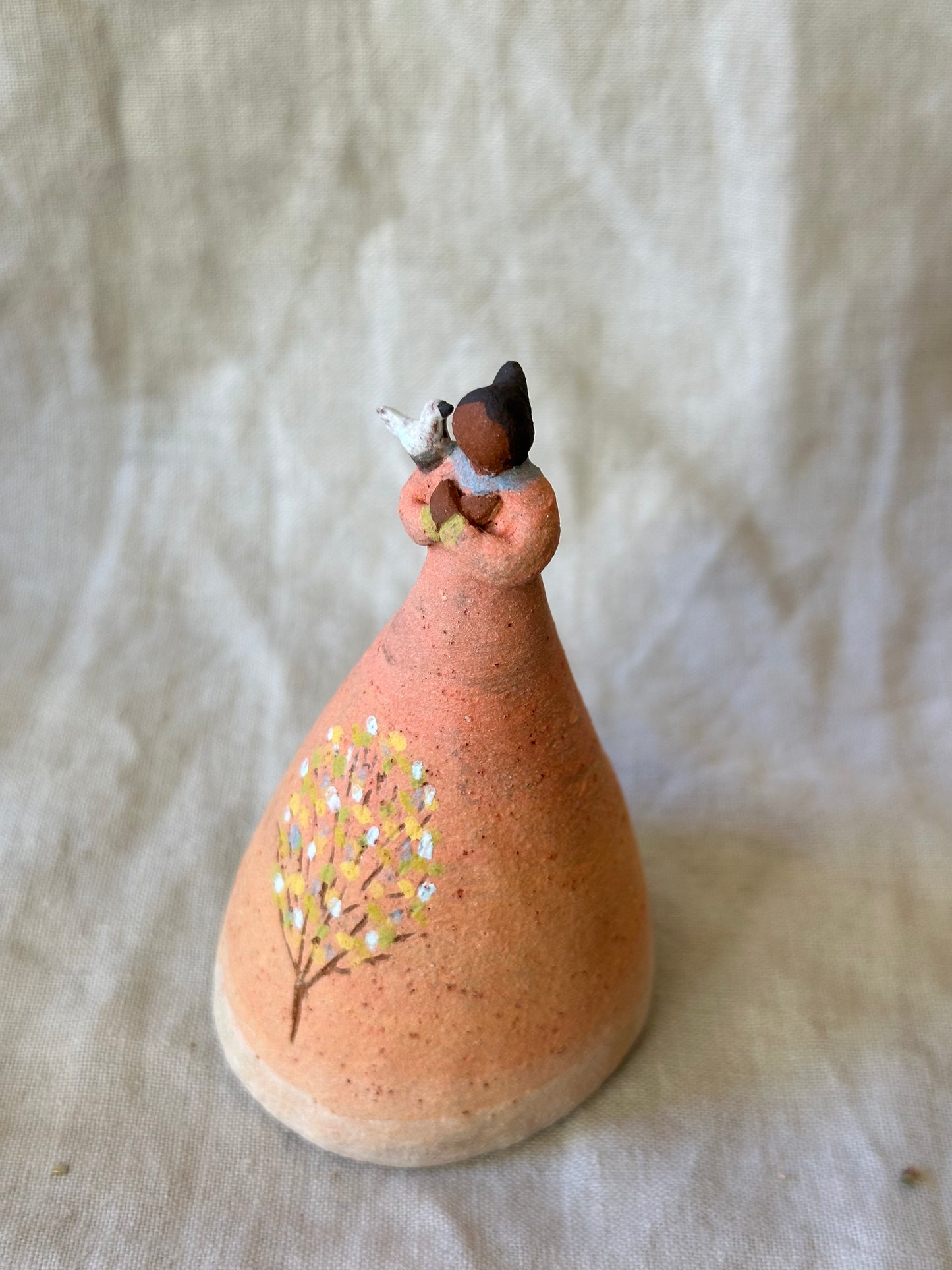 Dancer Bell with bird on shoulder - peach dress