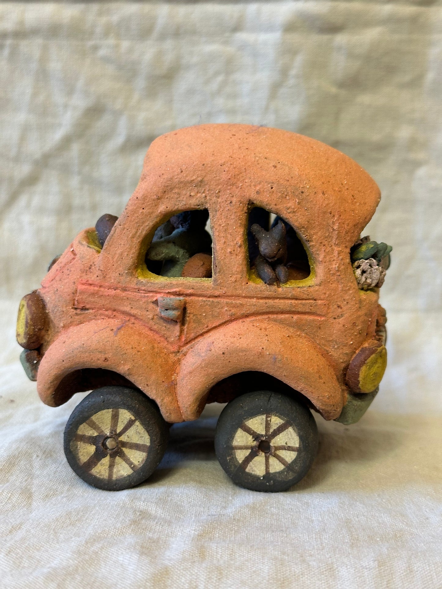 Family Trip with a Pink Beetle Car - mechanical wheels - miniature sculpture