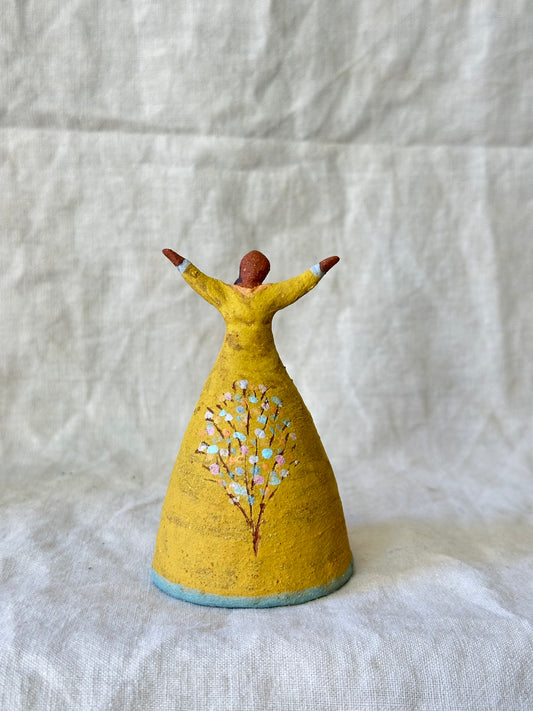 Dancer Bell - Yellow dress with tree design and open arms