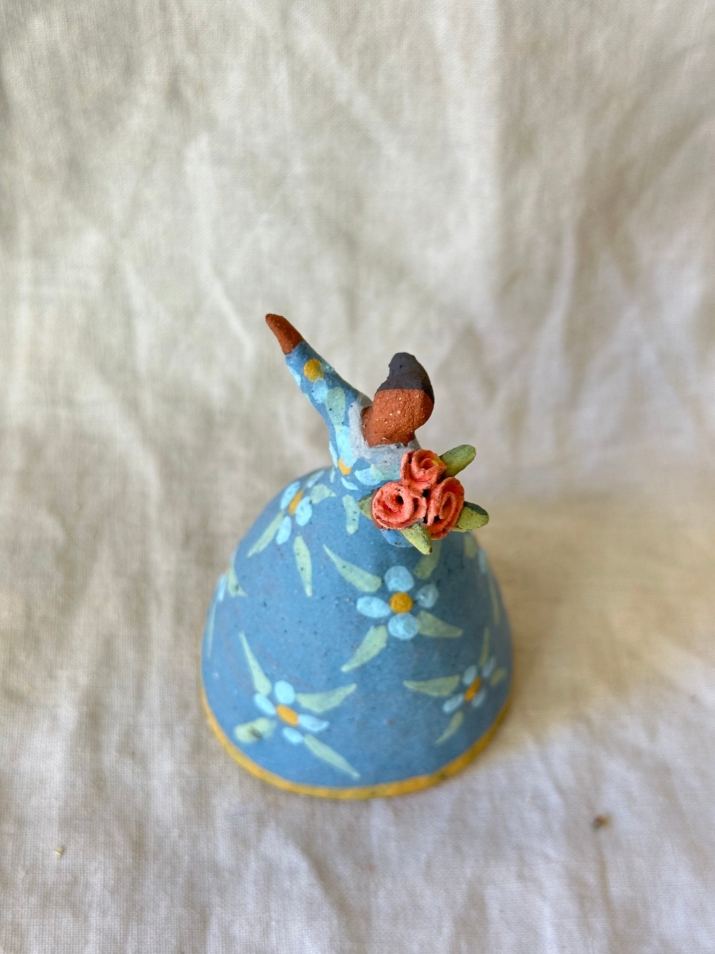 Dancer Bell holding flowers - Blue dress flower designs