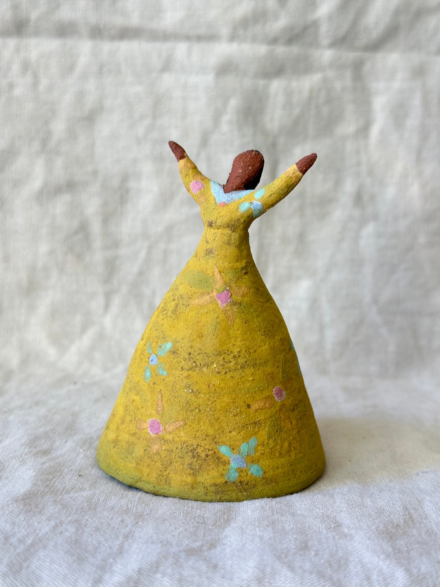 Dancel Bell - Yellow dress open arms