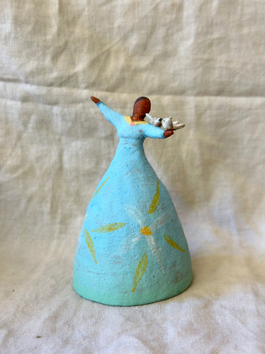 Dancer Bell holding birds - blue dress