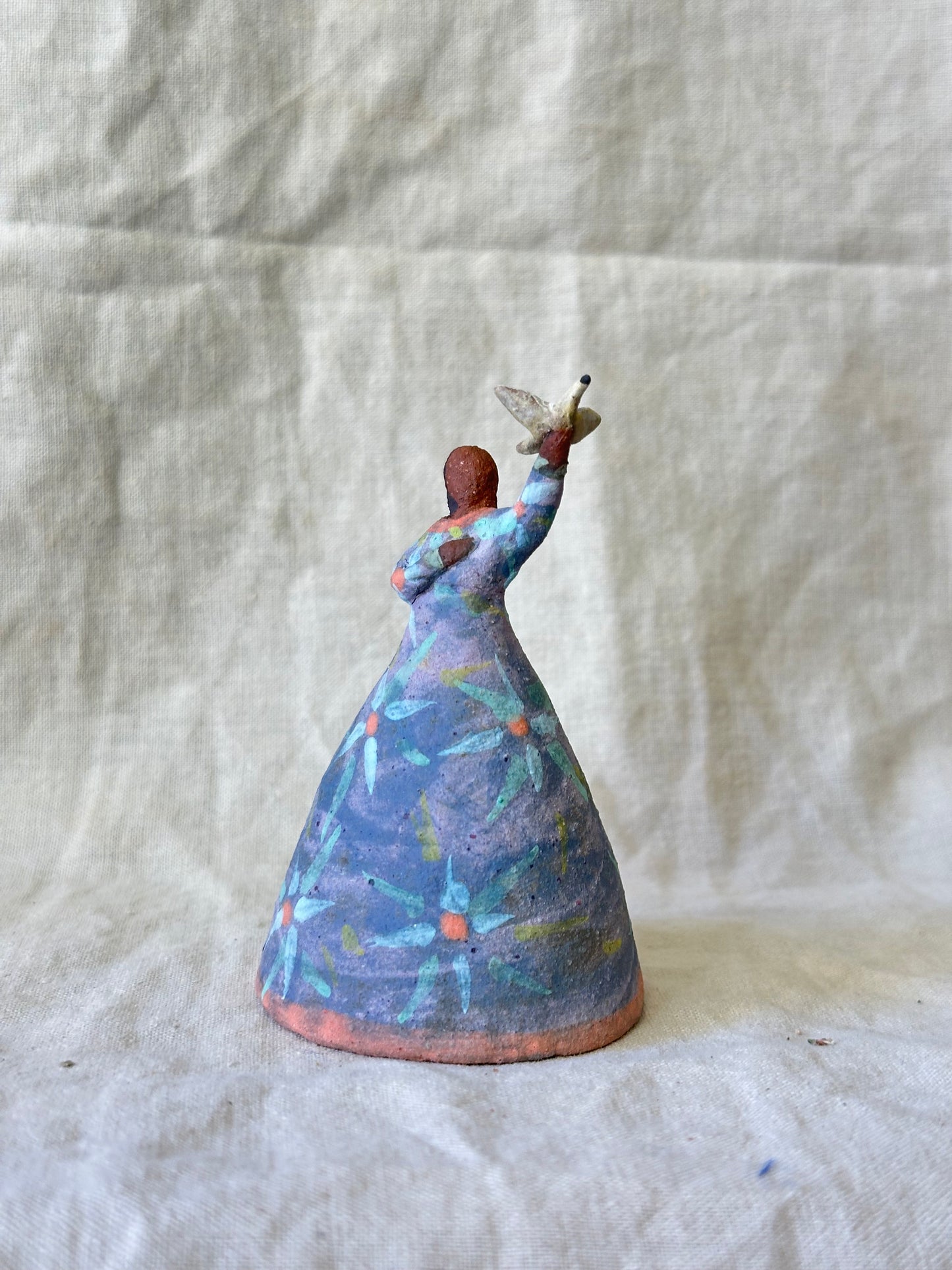 Dancer Bell holding a bird - purple dress flower designs