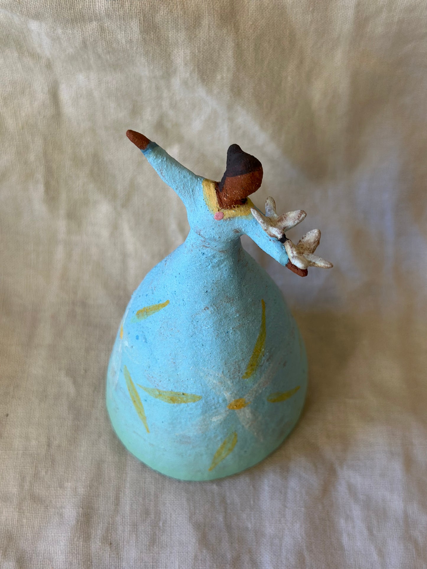 Dancer Bell holding birds - blue dress