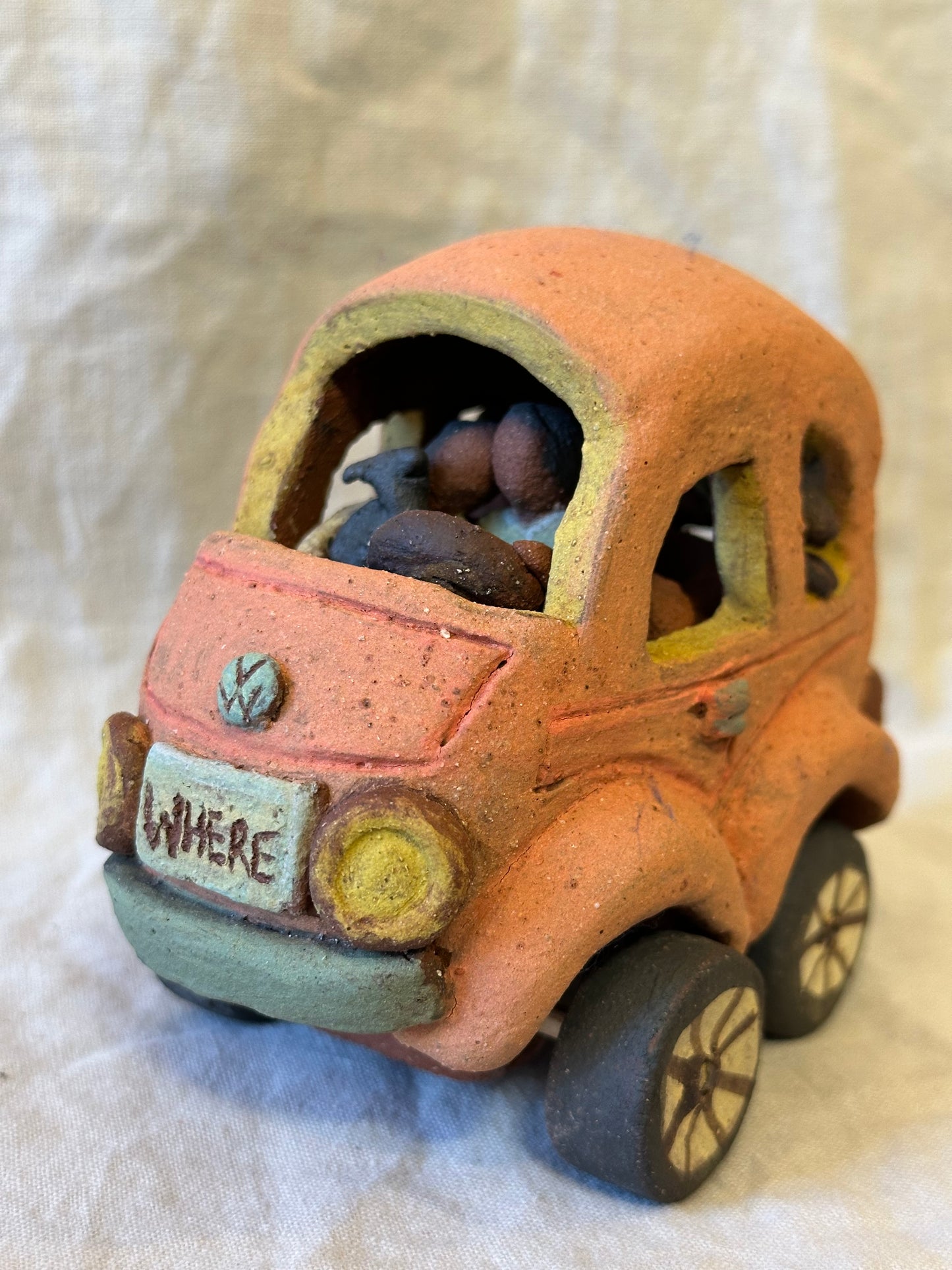 Family Trip with a Pink Beetle Car - mechanical wheels - miniature sculpture