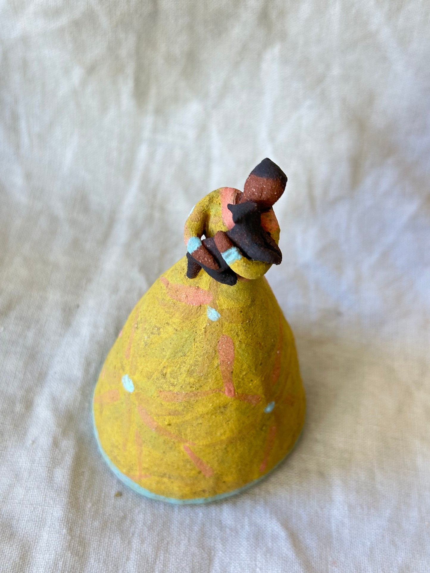 Dancer Bell holding a pet - yellow dress