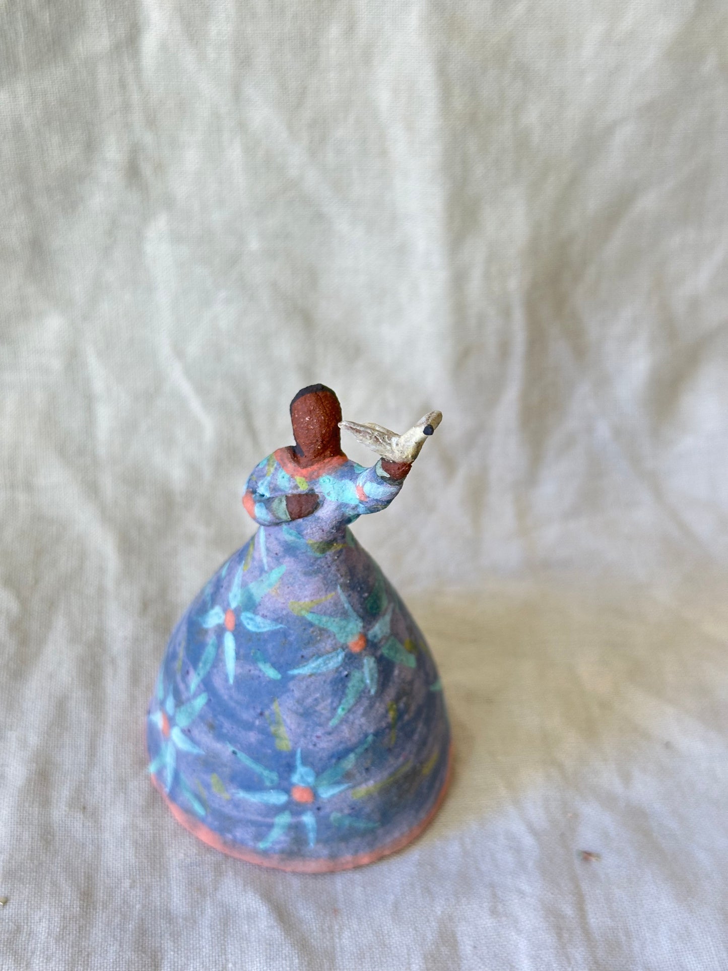 Dancer Bell holding a bird - purple dress flower designs