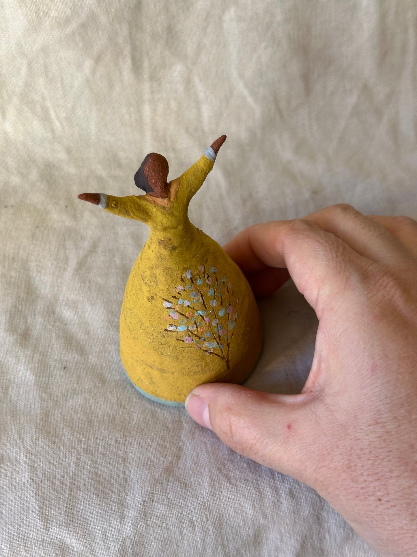 Dancer Bell - Yellow dress with tree design and open arms