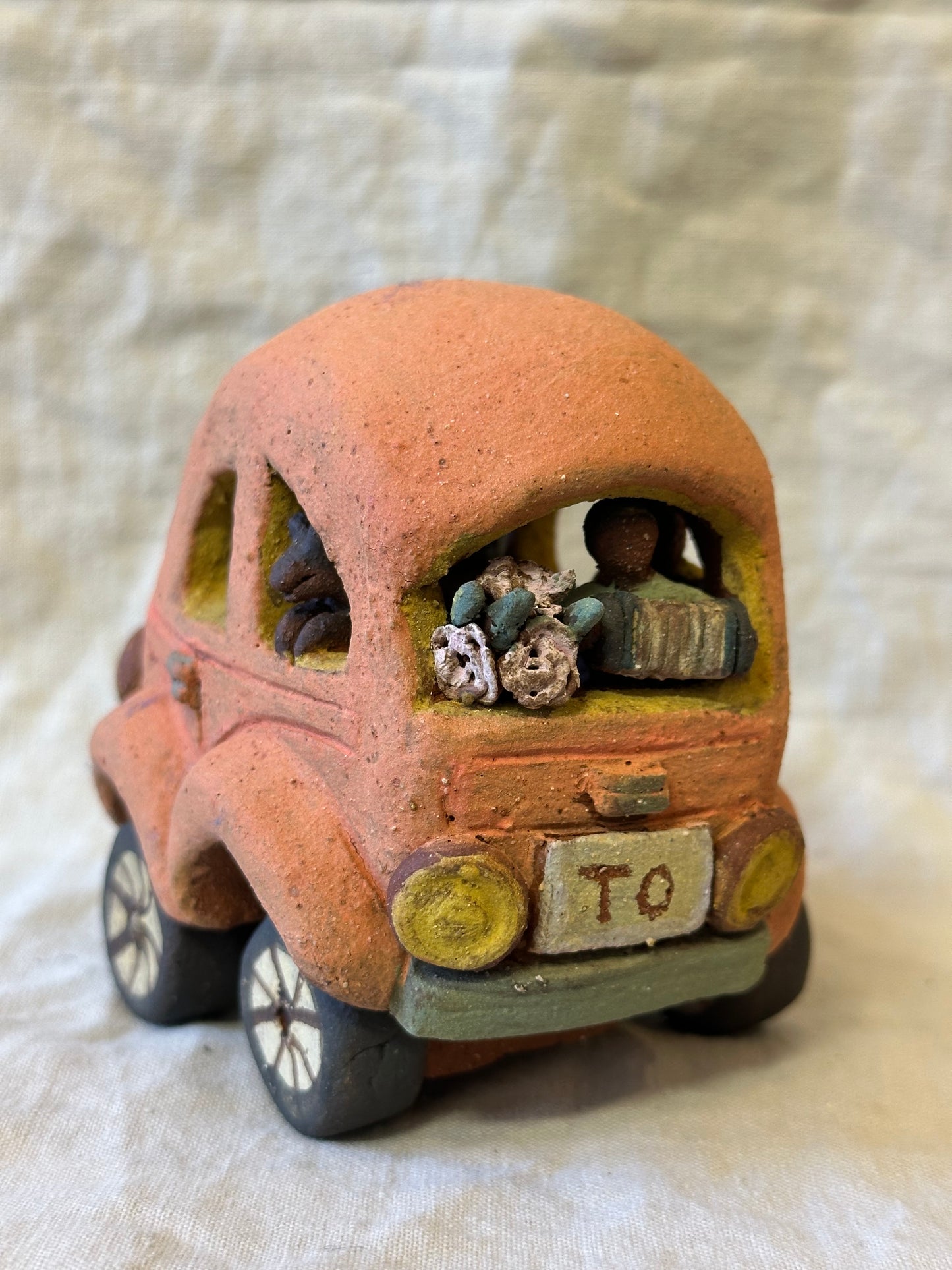 Family Trip with a Pink Beetle Car - mechanical wheels - miniature sculpture