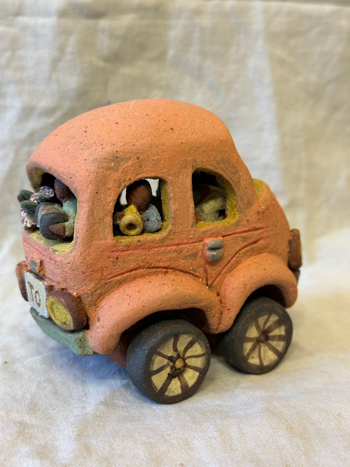 Family Trip with a Pink Beetle Car - mechanical wheels - miniature sculpture