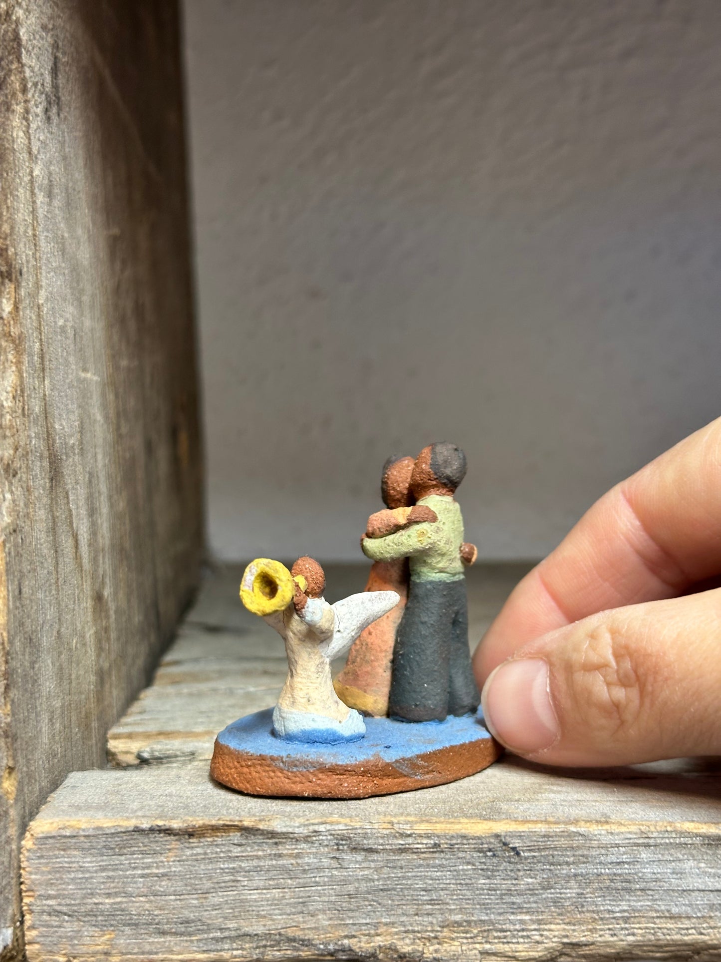 Dancing couple with an angel - miniature clay sculpture