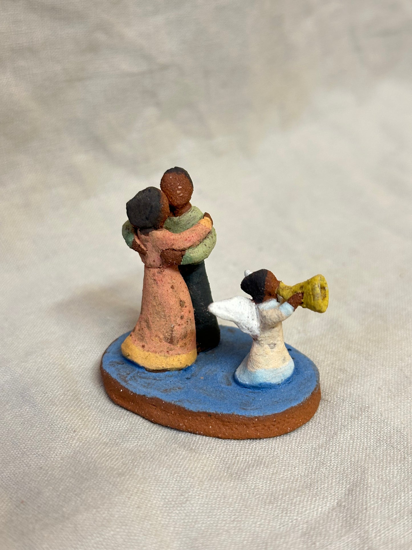 Dancing couple with an angel - miniature clay sculpture