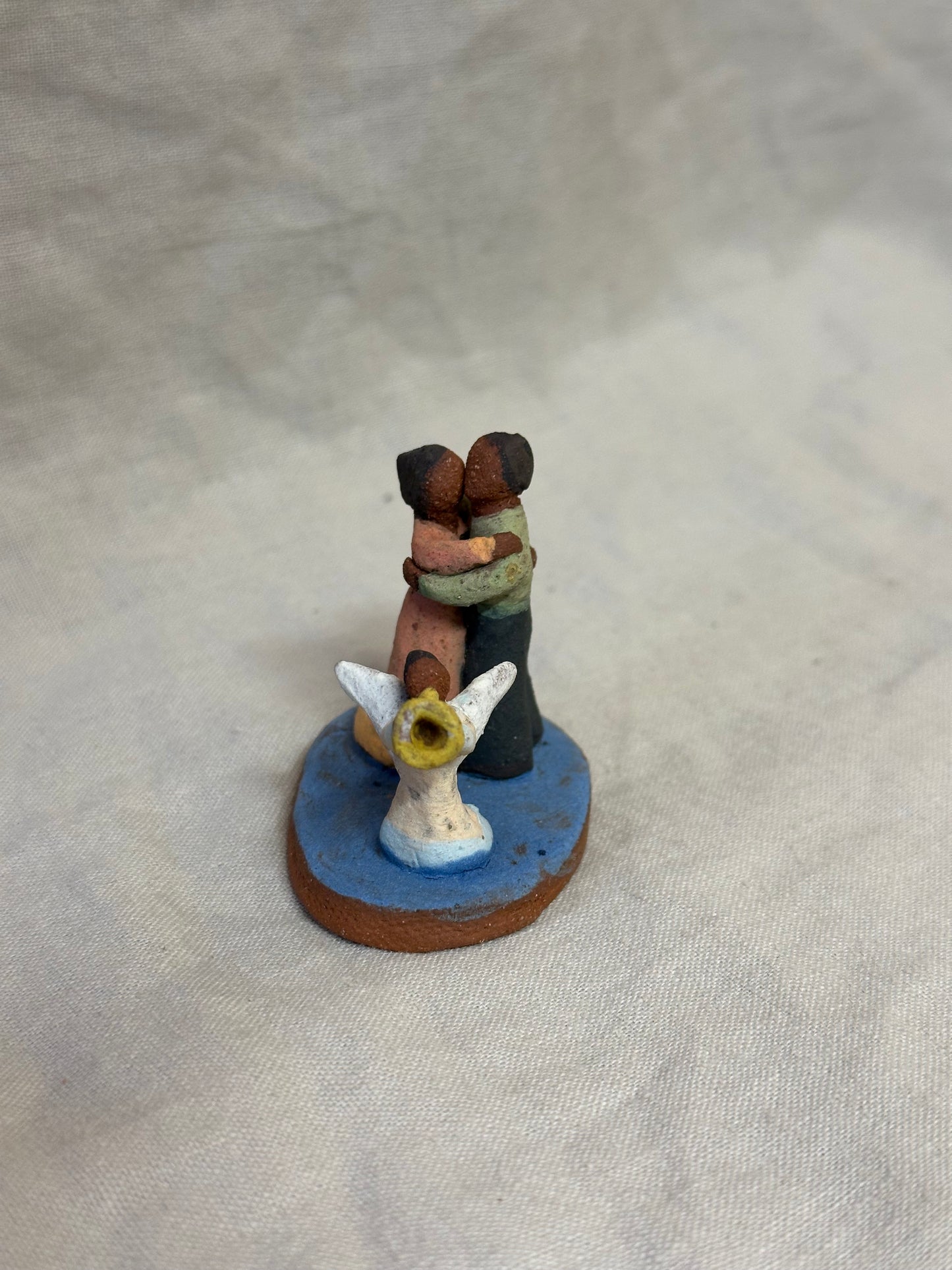 Dancing couple with an angel - miniature clay sculpture
