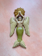 Sirena con alas