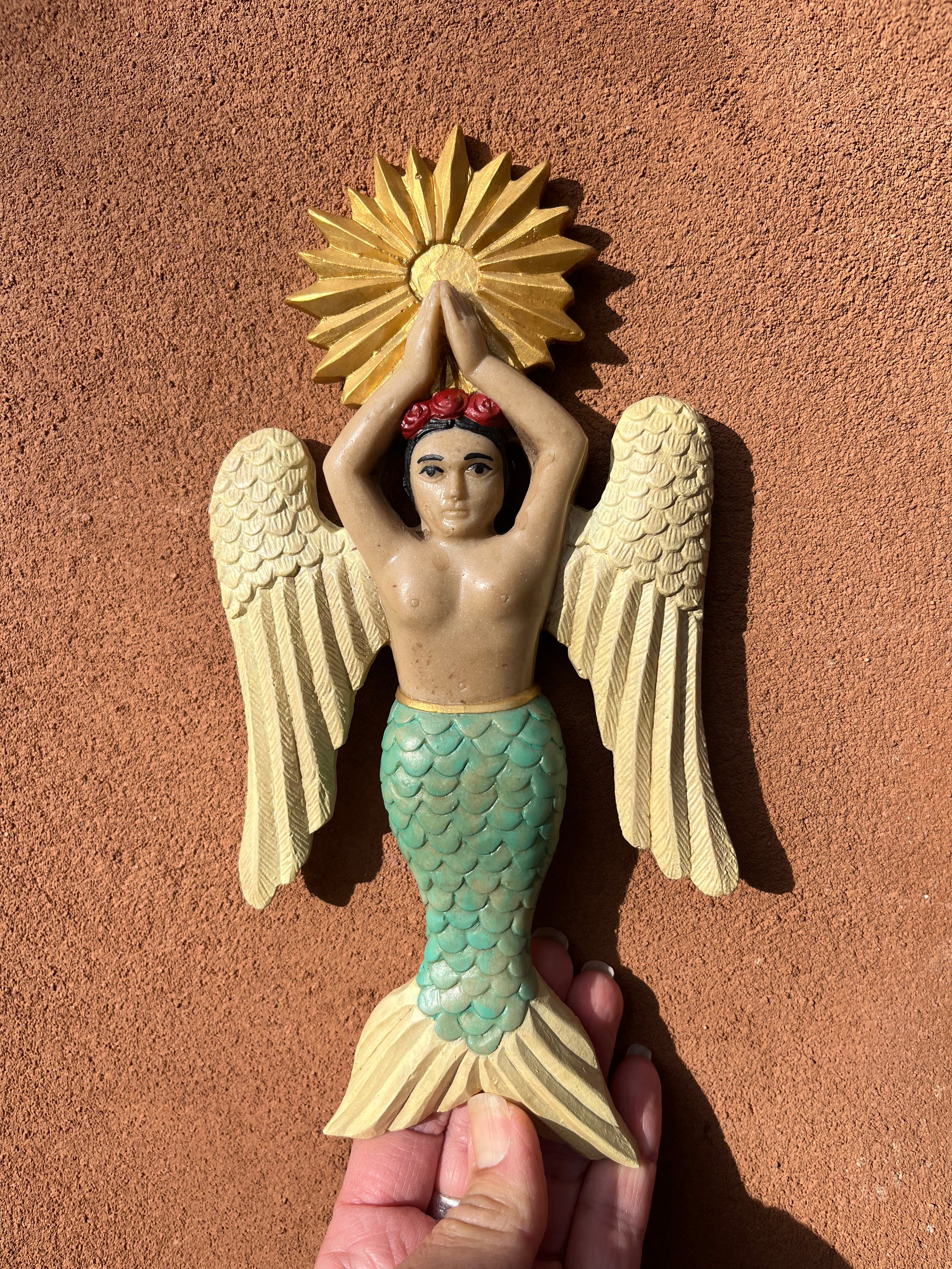 Sirena con alas