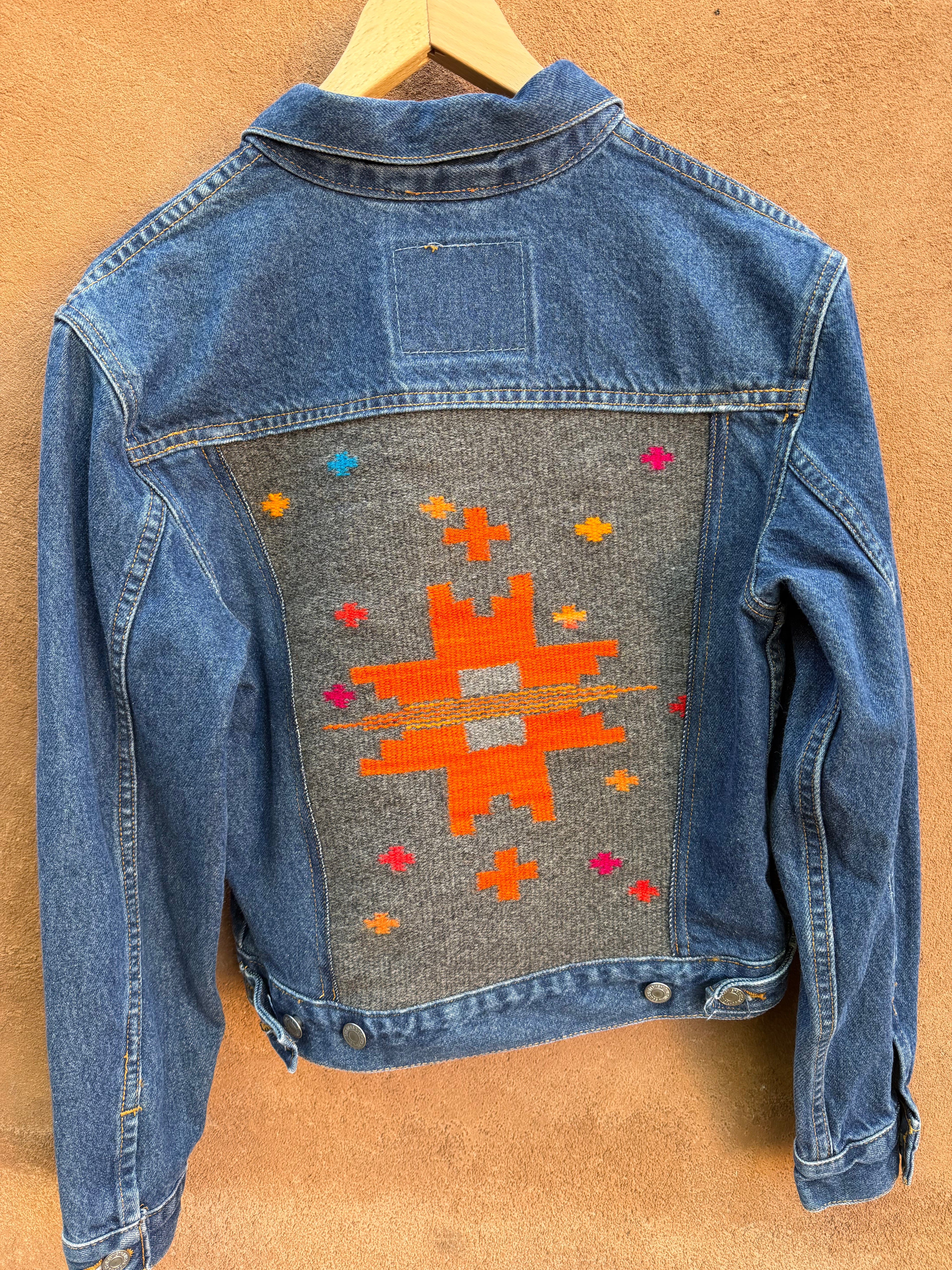 Second-Hand Levi's jacket with an original handwoven back panel- woven with 100% wool, undyed and commercially dyed yarns.