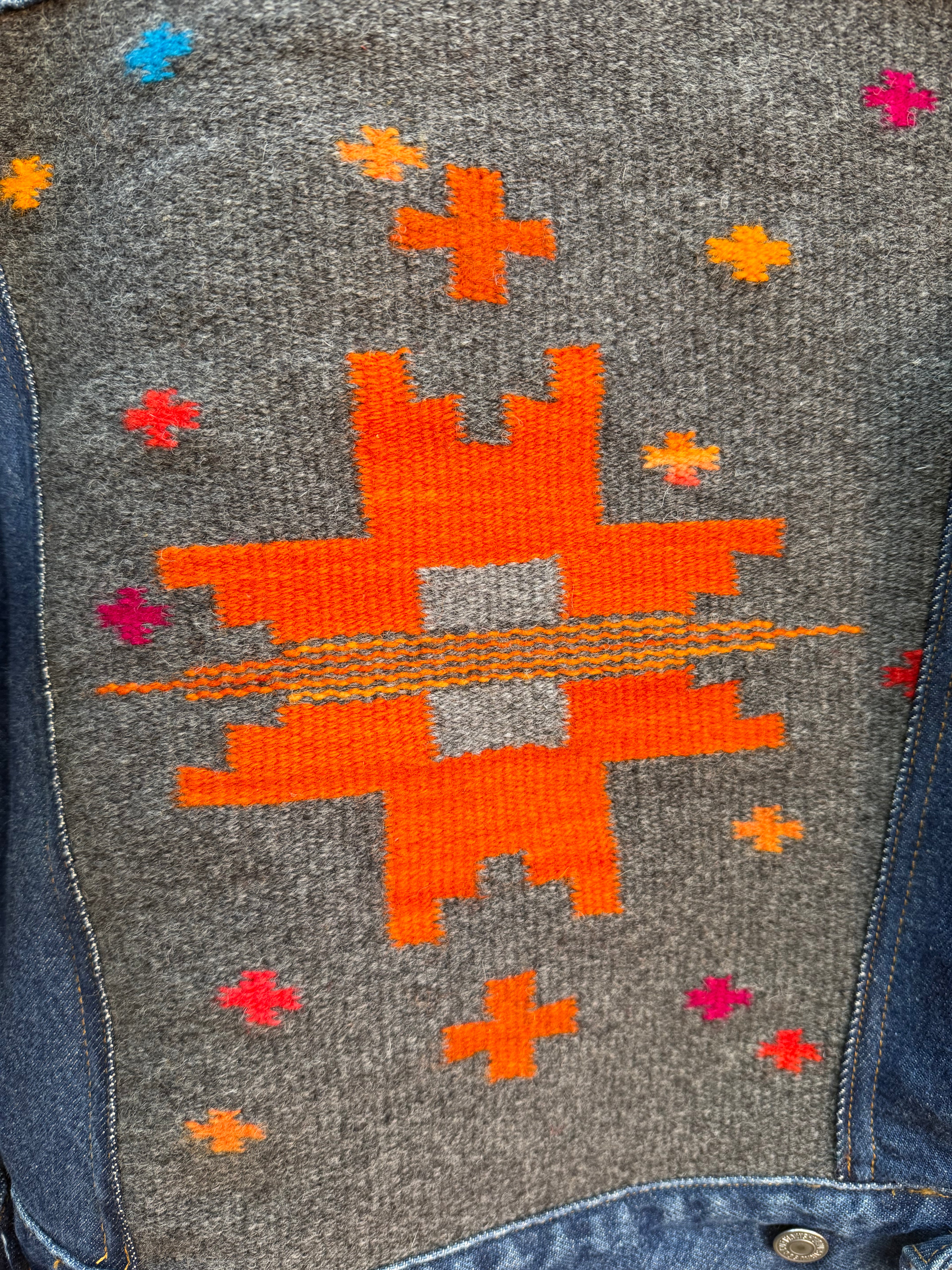 Second-Hand Levi's jacket with an original handwoven back panel- woven with 100% wool, undyed and commercially dyed yarns.