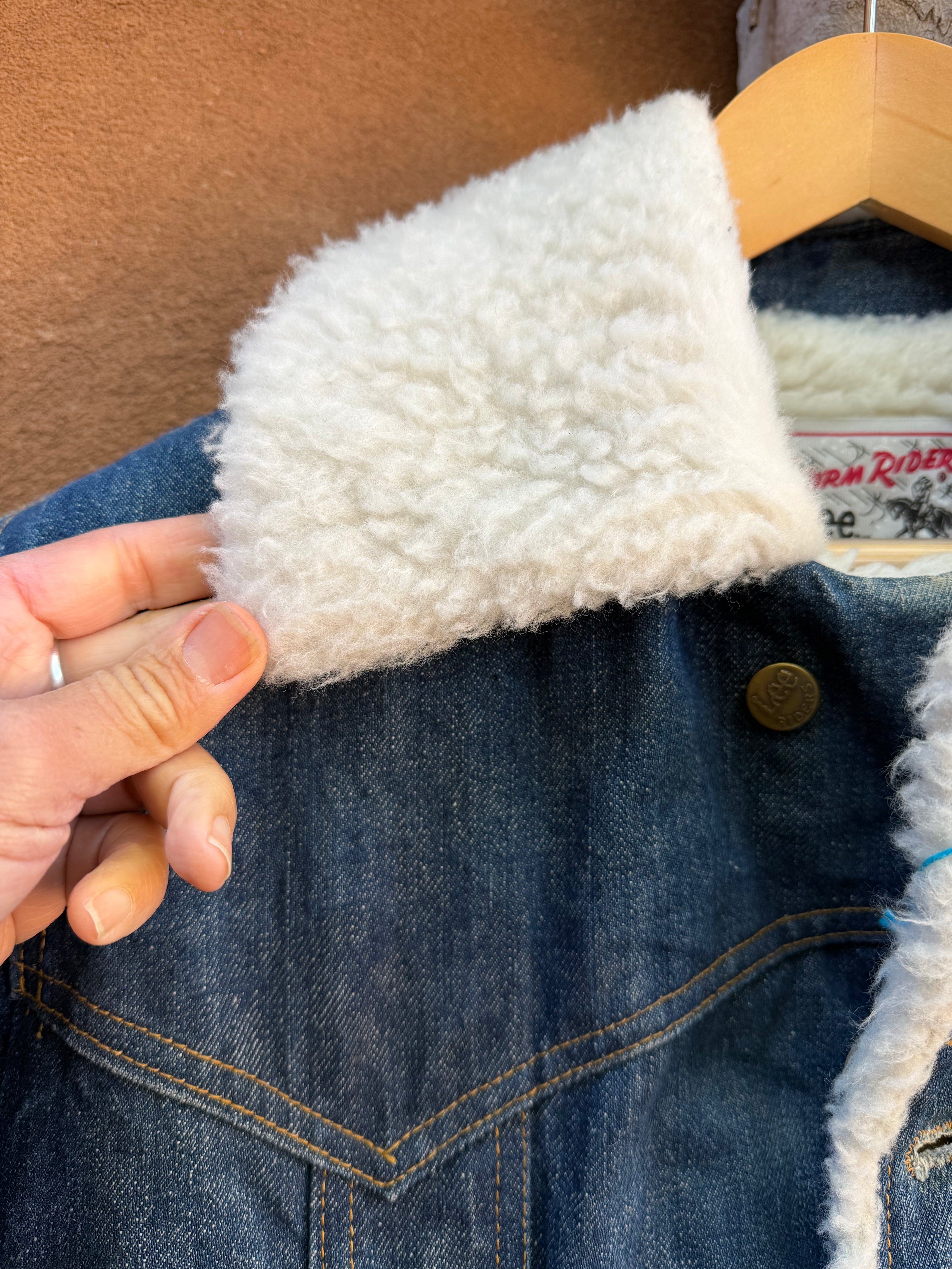 Second-Hand Lee fleece-lined denim jacket with an original handwoven back panel