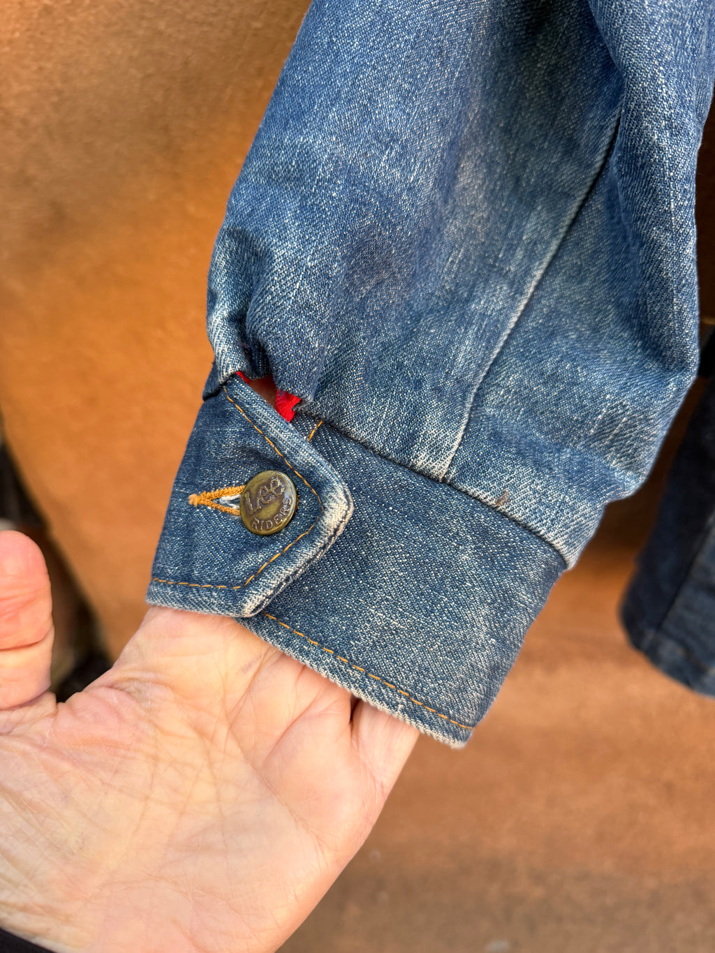 Second-Hand Lee fleece-lined denim jacket with an original handwoven back panel