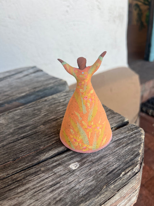 Dancer Bell - Coral dress arms raised