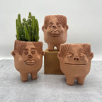 Terracota face planter with legs