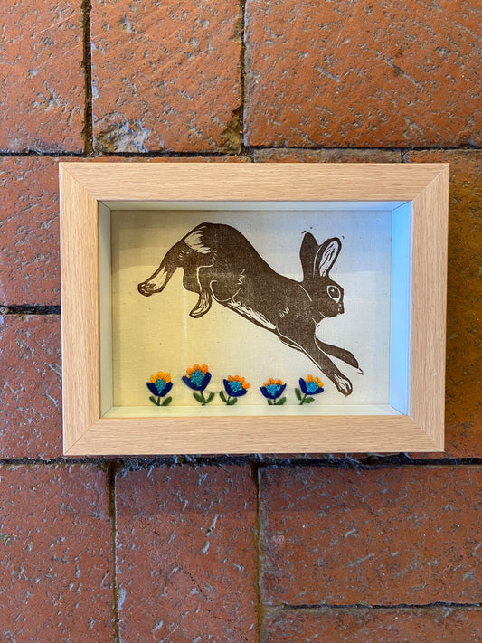 Shadow box ~ Rabbit jumping printed on fabric with hand embroidery ~ orange & blue flowers