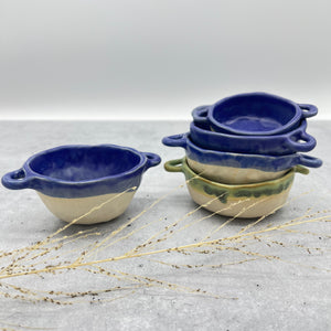 Assorted bowls with handles