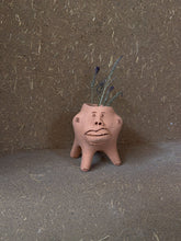 Load image into Gallery viewer, Little terracota face planter with legs
