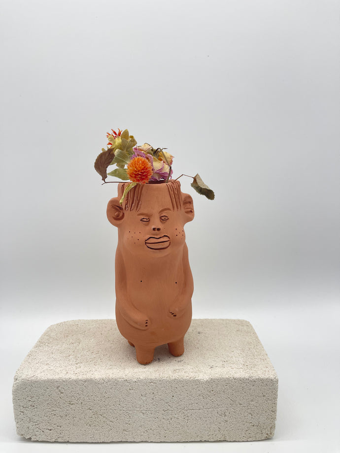 Terracota face planter with legs and arms