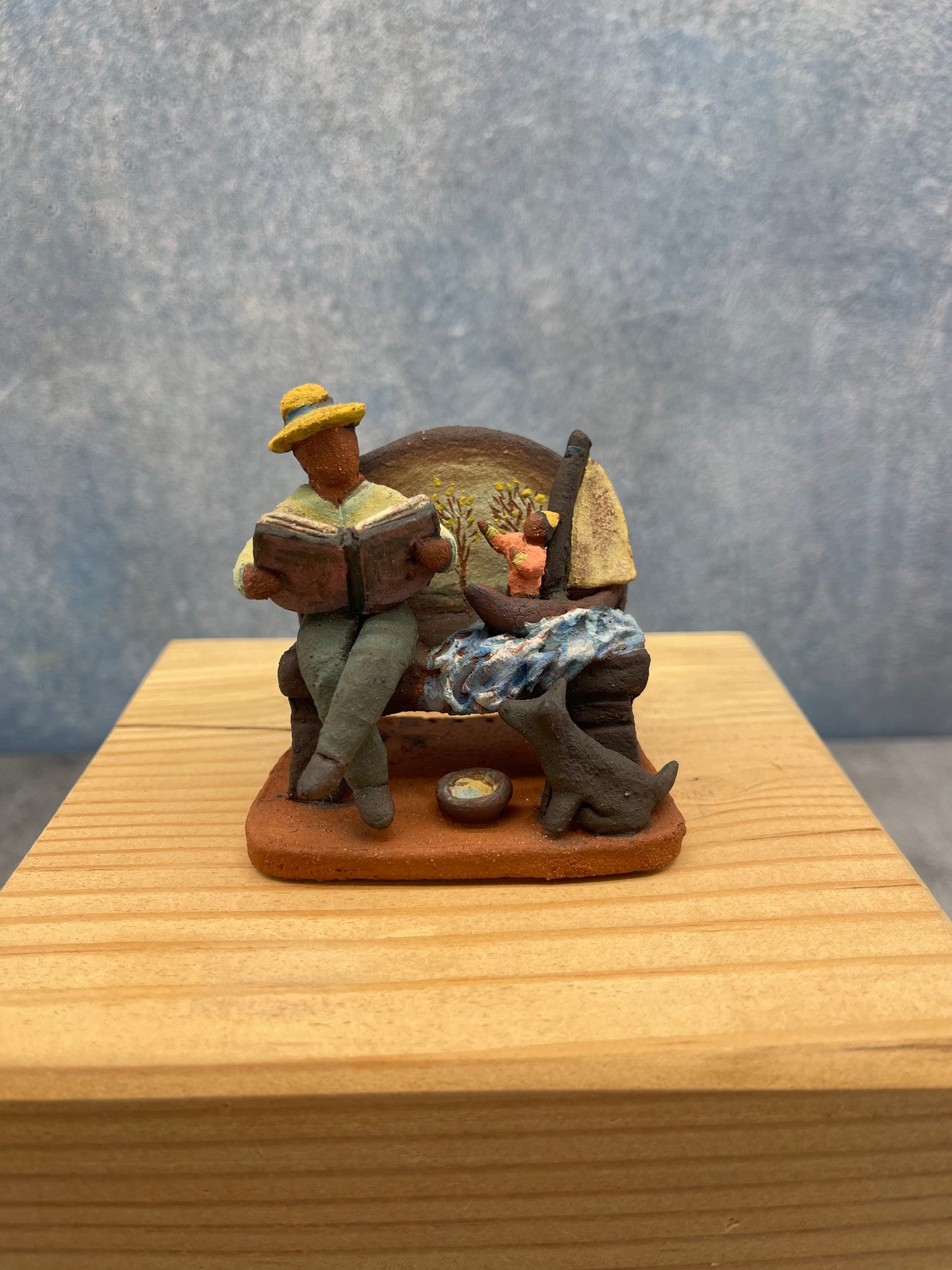 Bench with boat miniature sculpture