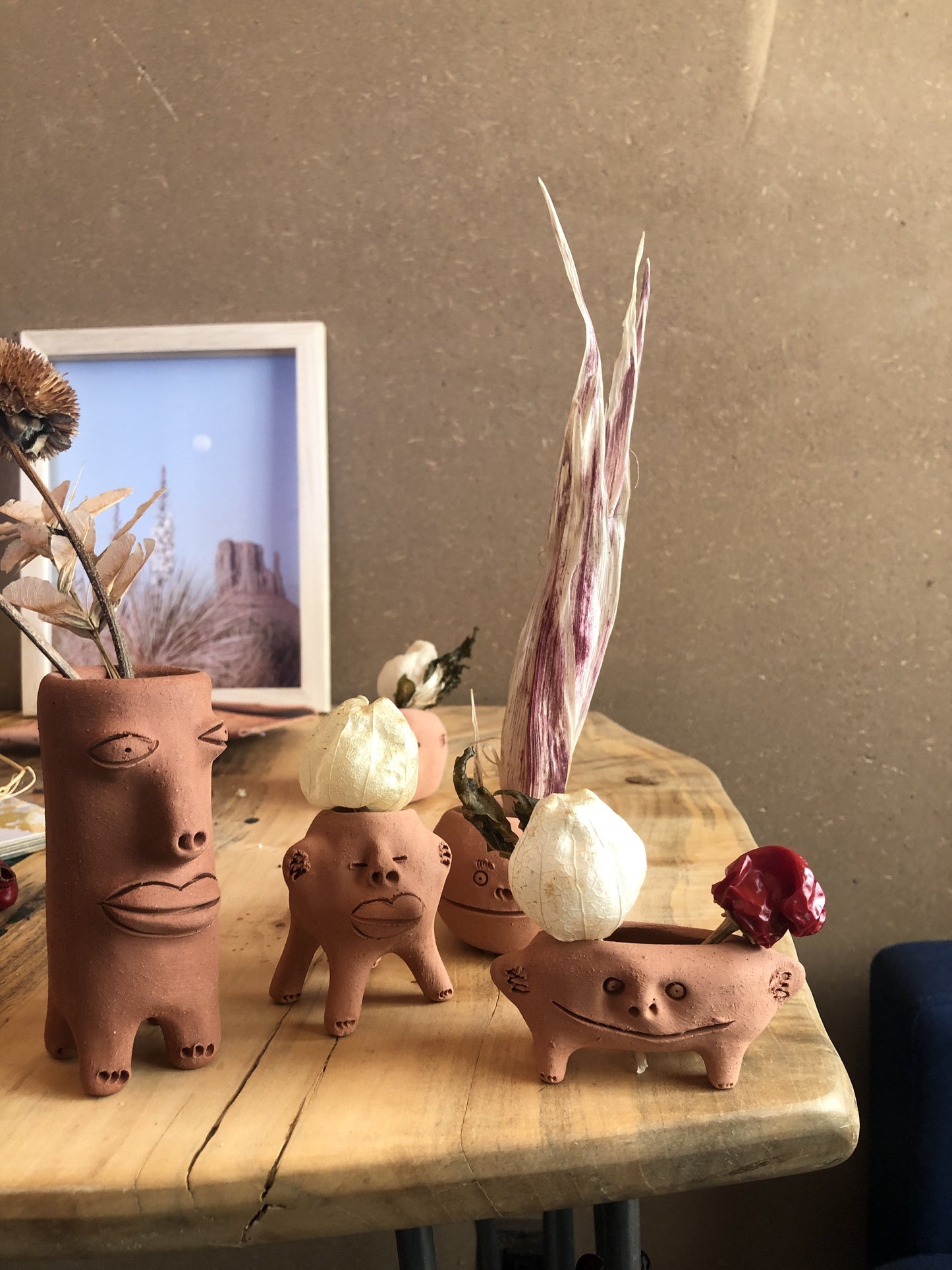 Little terracota smiling face planter